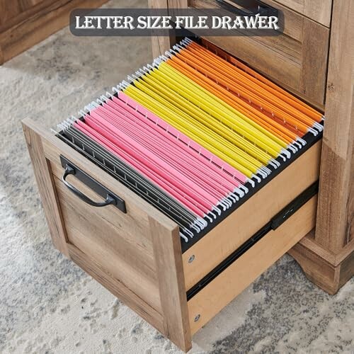 Open drawer with colorful hanging file folders.