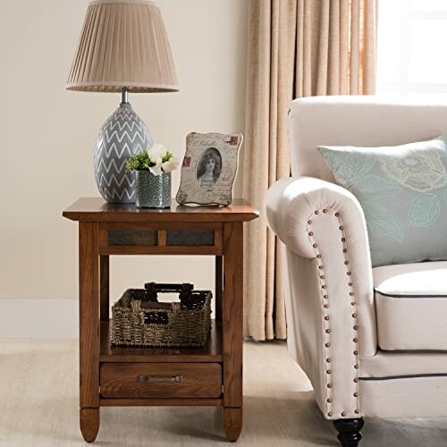 Living room with side table, lamp, photo frame, and sofa.