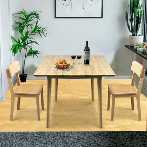 Minimalist dining room with wooden table, two chairs, wine bottle, and fruit bowl.