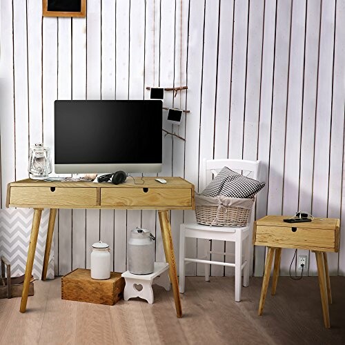 Modern wooden desk with computer, chair, and small table.