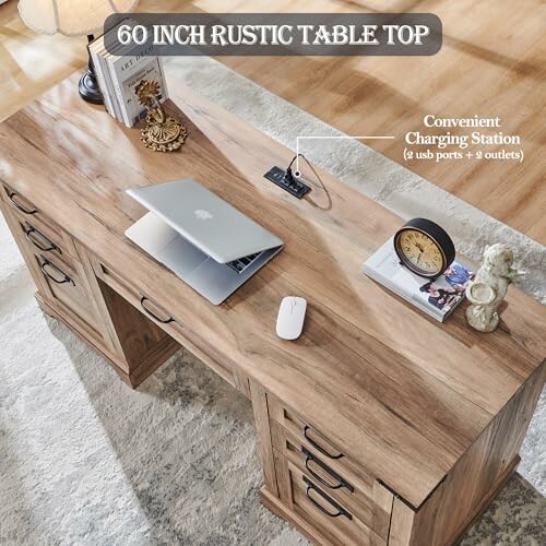 Rustic desk with charging station, laptop, and accessories.