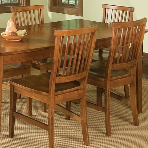 Wooden dining table with four chairs