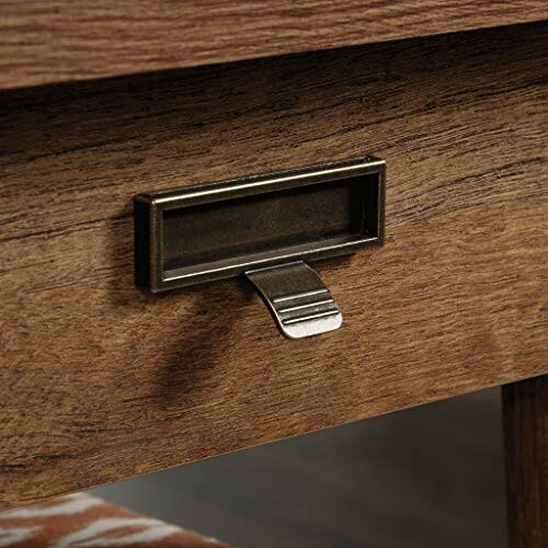 Close-up of a wooden drawer with a metal handle