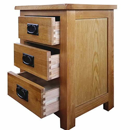 Wooden cabinet with three open drawers.